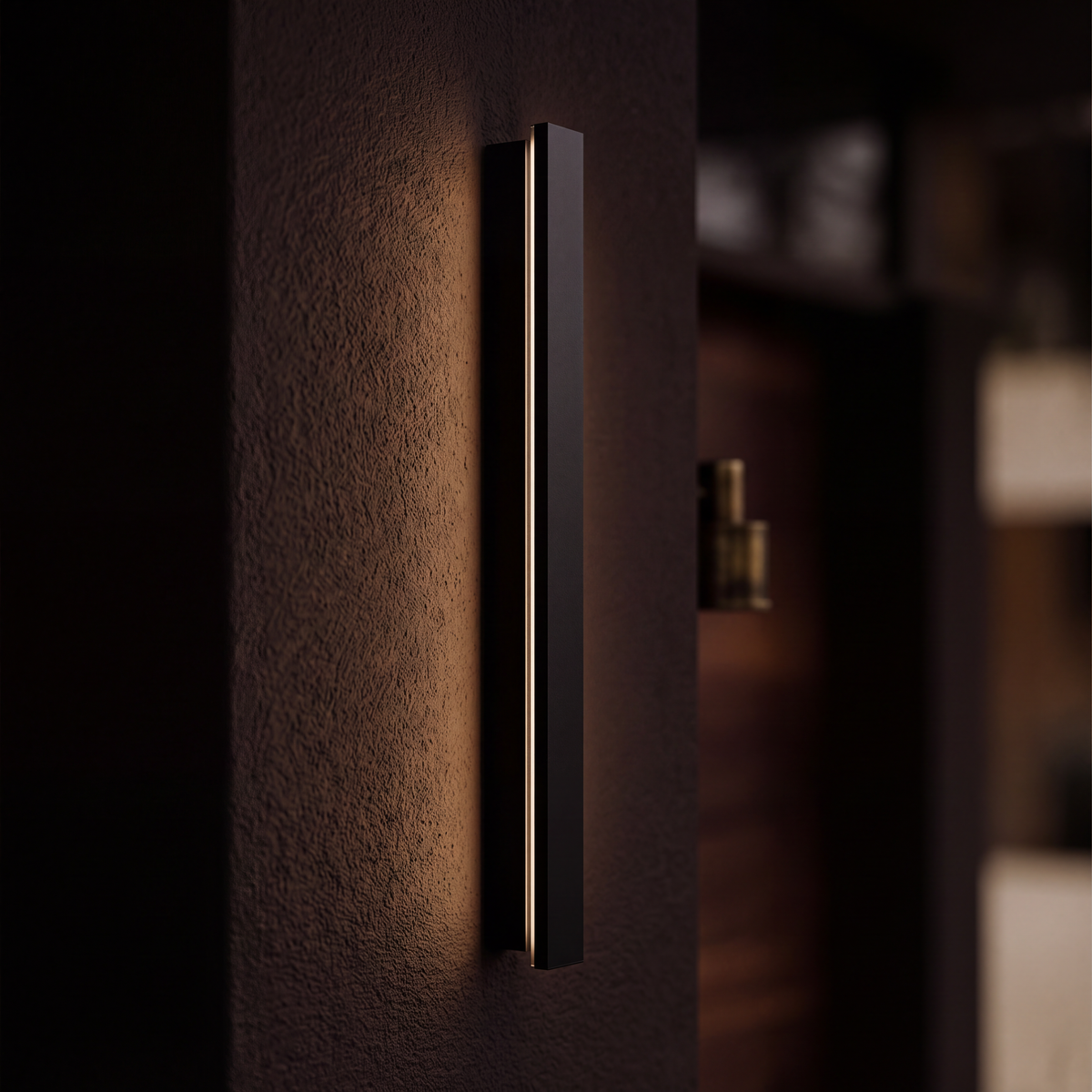 Close view of the black aluminium outdoor light grazing a rendered wall